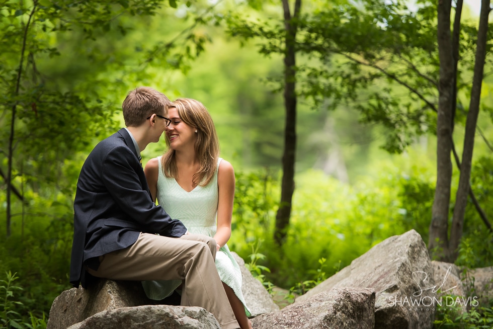 Couple sitting on rock at their Borderland State Park Engagement photos