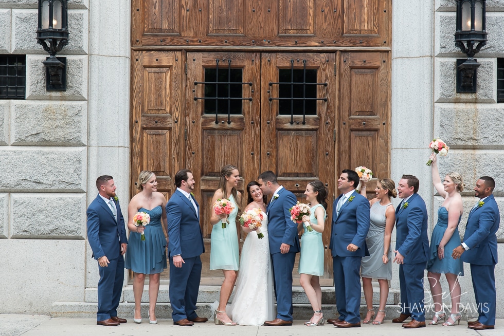 Wedding party photos in front of brown door at the Liberty Hotel wedding photo