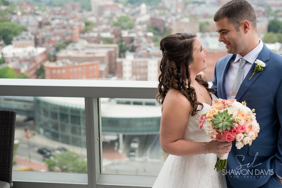 Bride and Groom on balcony at the Liberty Hotel wedding photo
