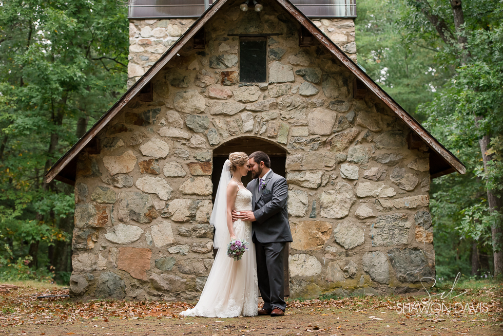 bride and groom in the woods at hale reservation wedding photo