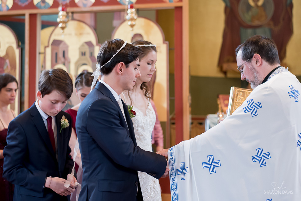 Beautiful bride wearing wedding gown from Madeleine's DGreek Orthodox Wedding ceremony photographed by Shawon Davis in Newburyport, MA. See more here: https://bit.ly/2PqcKyj