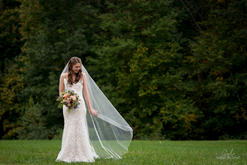 Beautiful bride wearing wedding gown from Madeleine's Daughter in Portsmouth, NH before the ceremony Greek Orthodox Wedding photographed by Shawon Davis in Newburyport, MA. See more here: https://bit.ly/2PqcKyj