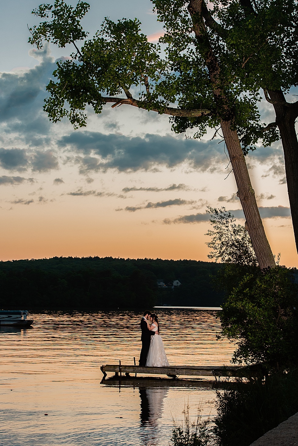 amazing sunset photo of bride and groom at Lake Pearl summer wedding