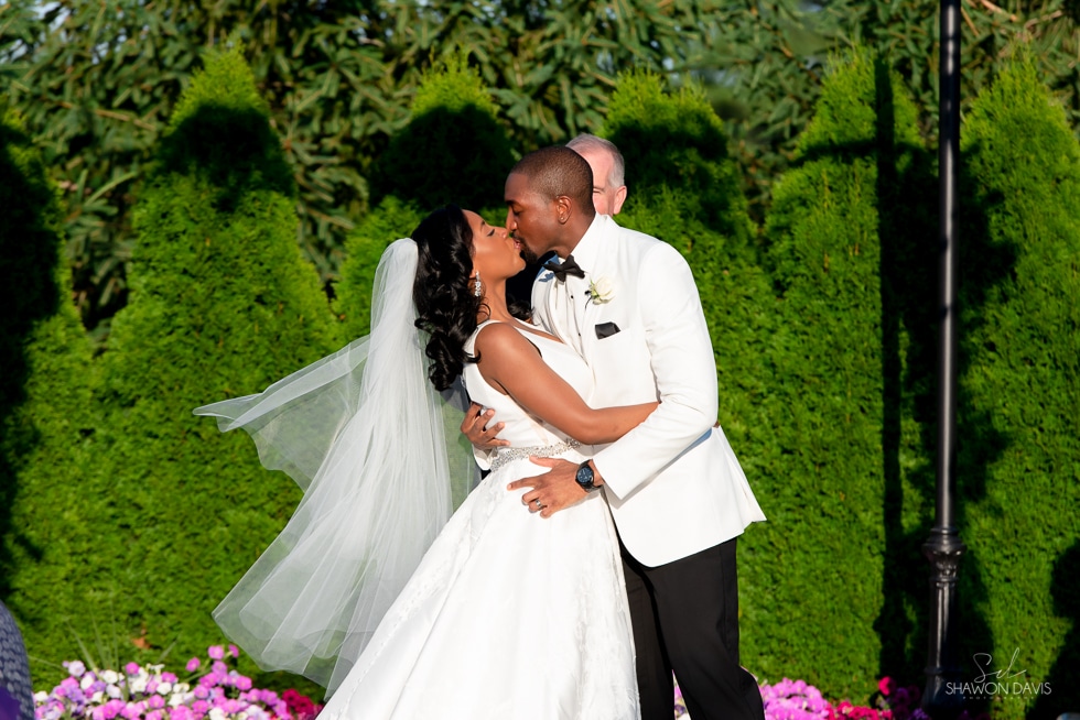 bride and groom first kiss  wedding at the villa at ridder country club