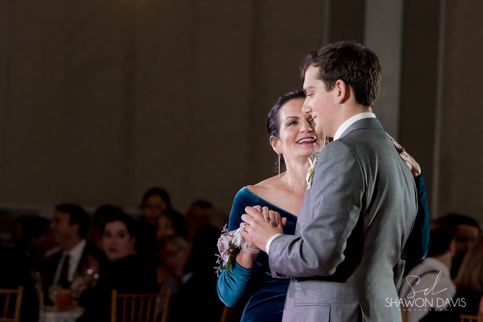 groom and mom dance at hyatt regency cambridge hotel wedding 