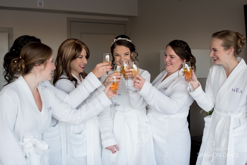 bride and bridesmaids toast at hyatt regency cambridge hotel