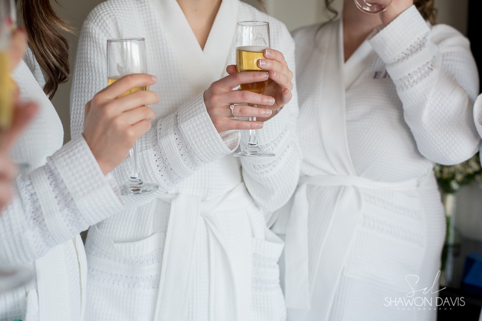 bride and bridesmaids toast 
