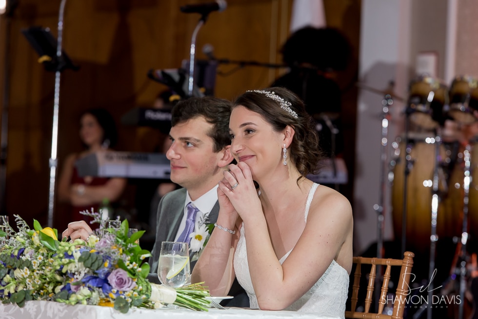 candid moment of bride and groom at reception at  hyatt regency cambridge hotel wedding 