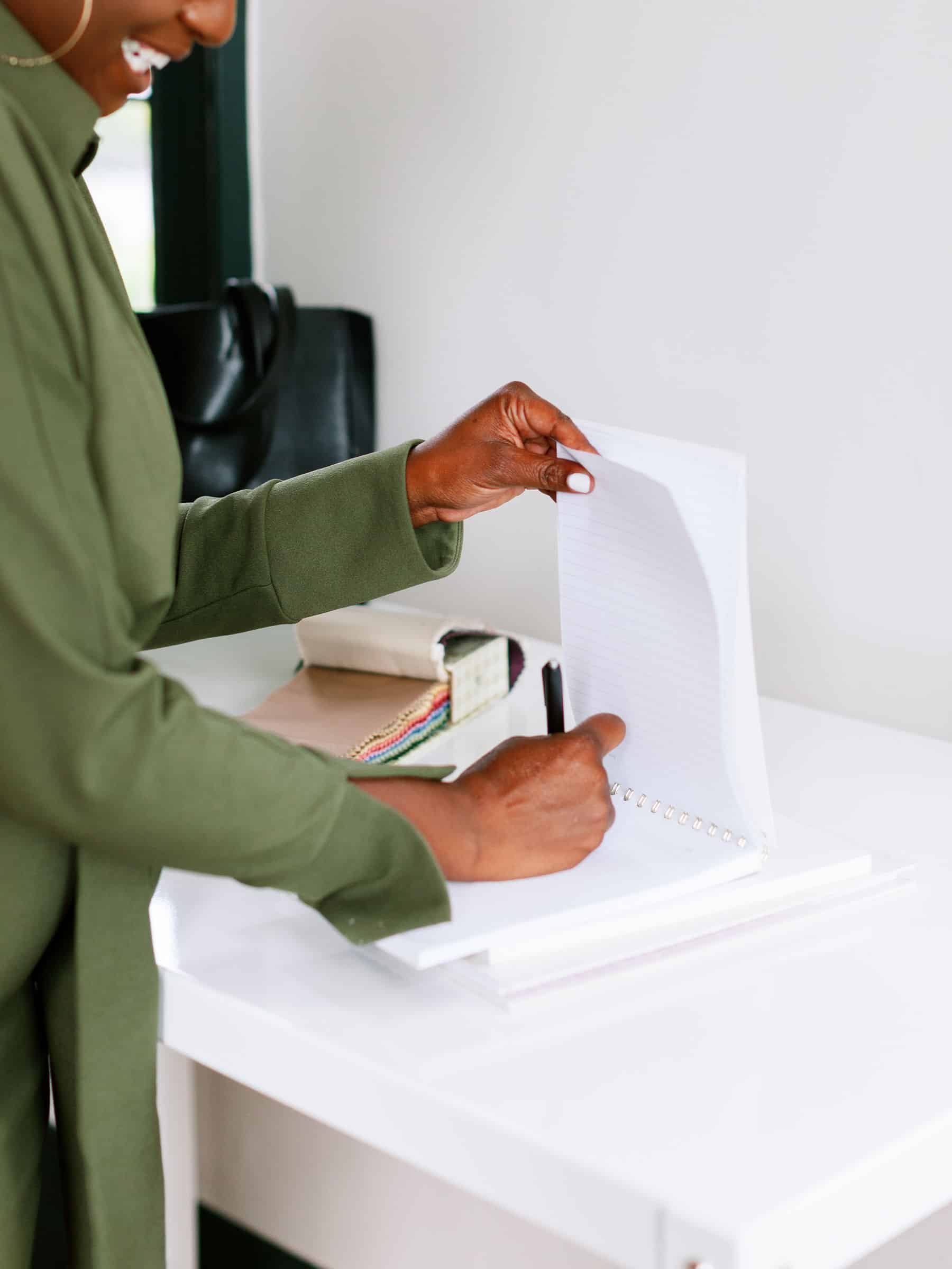 picture of a woman writing in a notebook